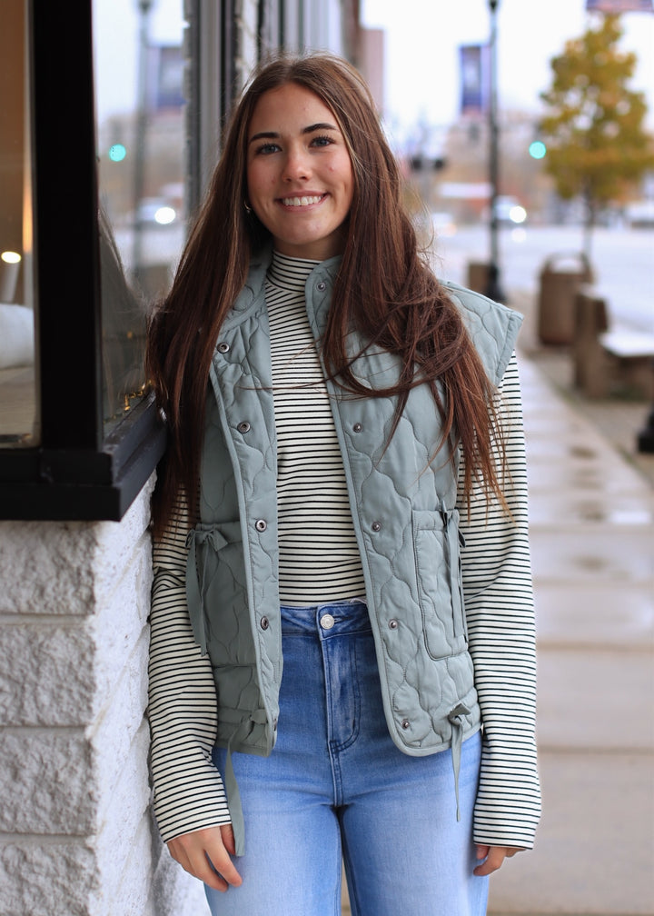 The Alpine Tie Puffer Vest in Dusty Sage