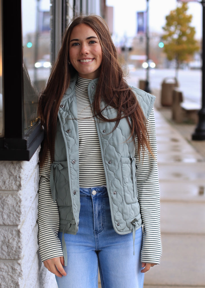 The Alpine Tie Puffer Vest in Dusty Sage